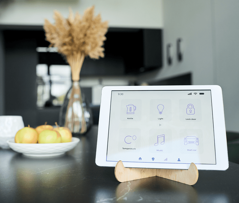 Tablet displaying smart home controls in kitchen.